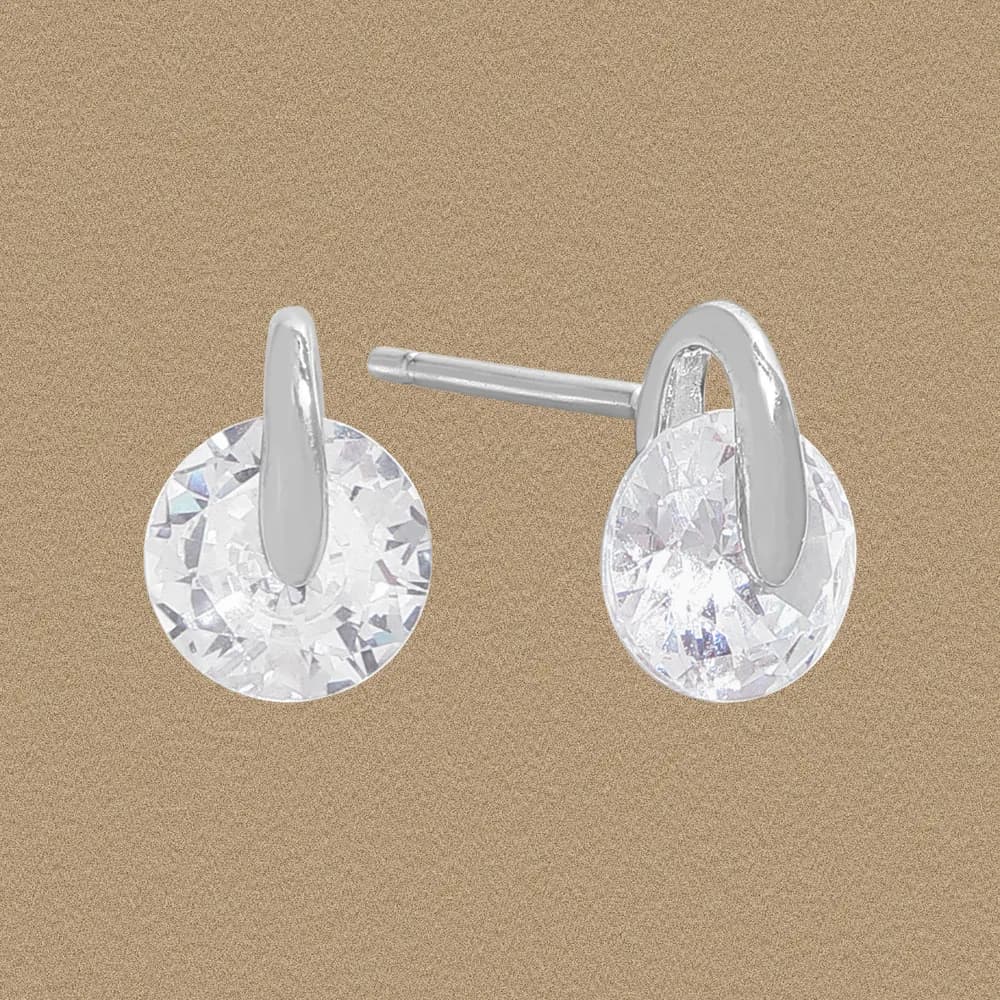 Polished sterling silver stud earrings with a round crystal disk and a vertical bar setting.