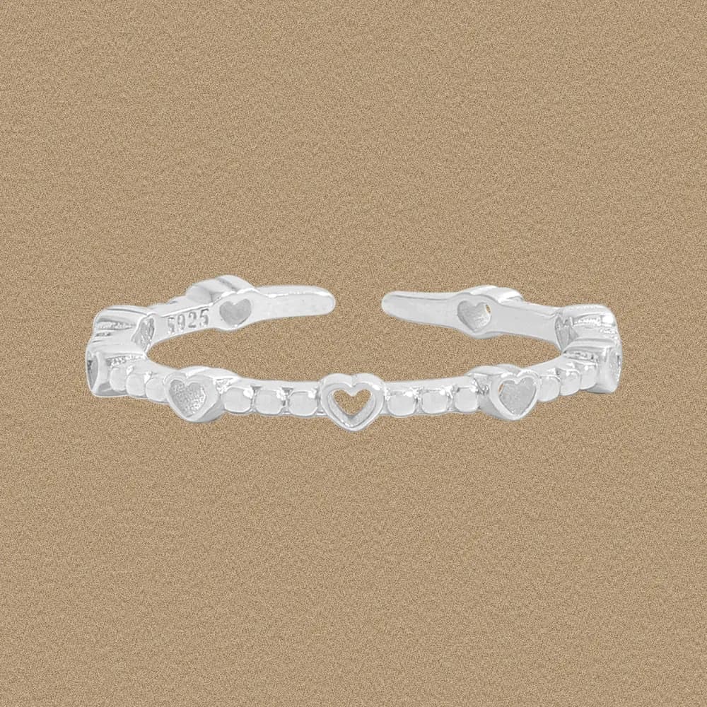 Polished sterling silver open ring with repeating heart motifs along the band