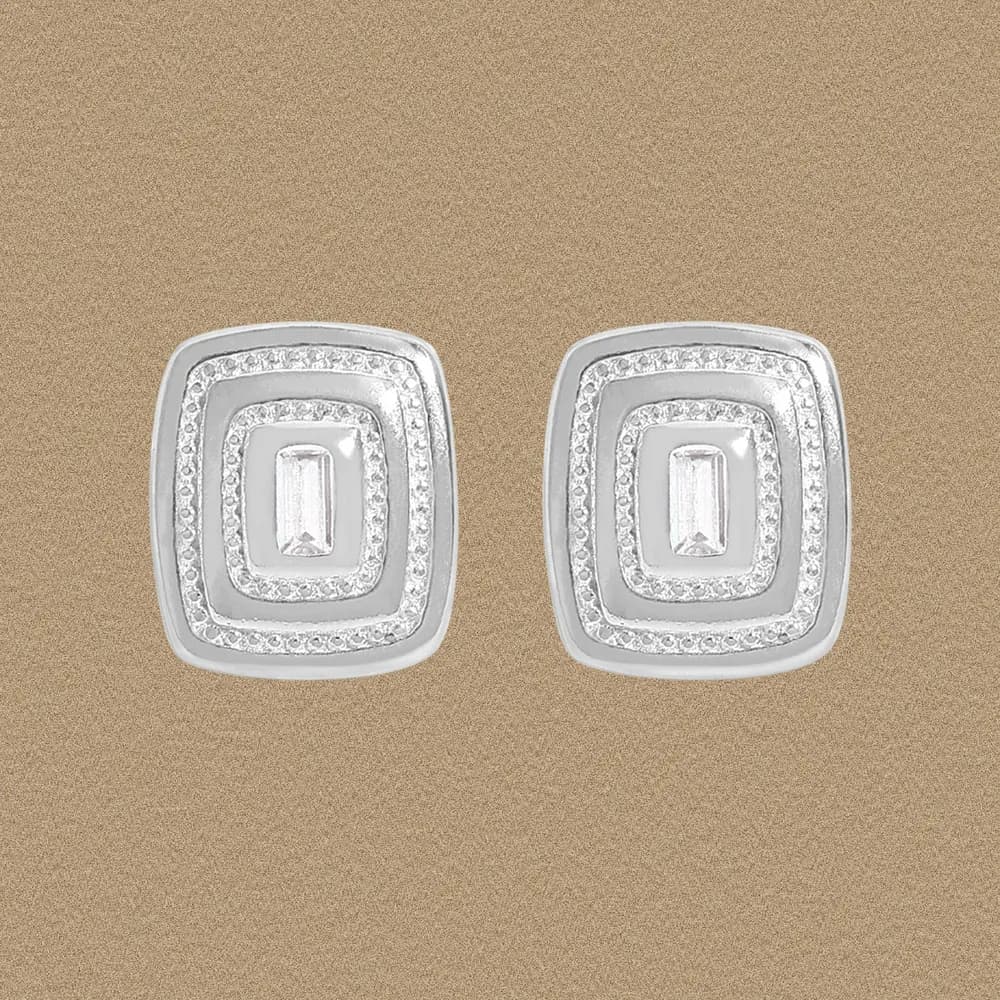 Polished sterling silver squared halo earrings with a rectangular baguette center stone