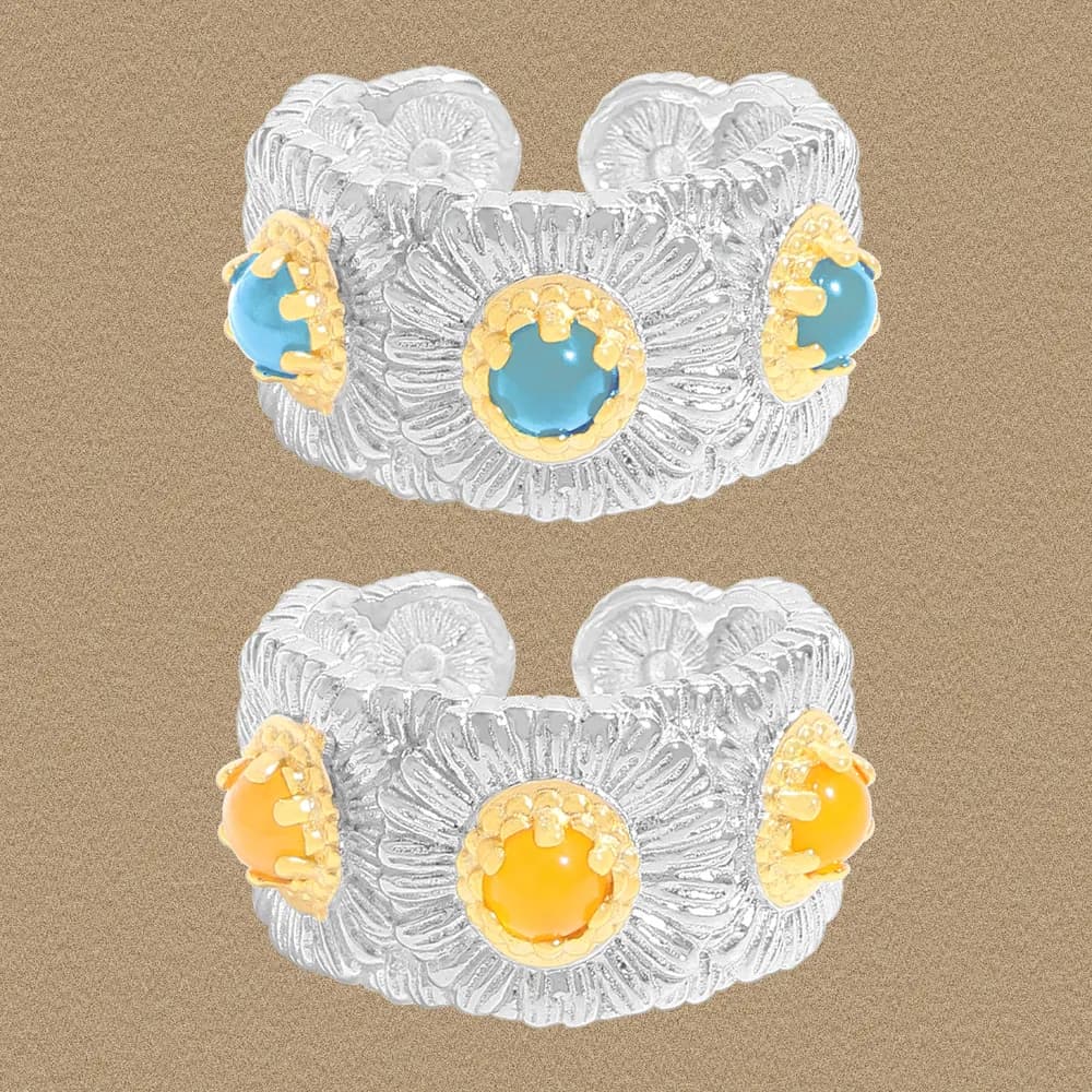 Wide textured silver floral band ring with three colorful cabochons in gold settings.
