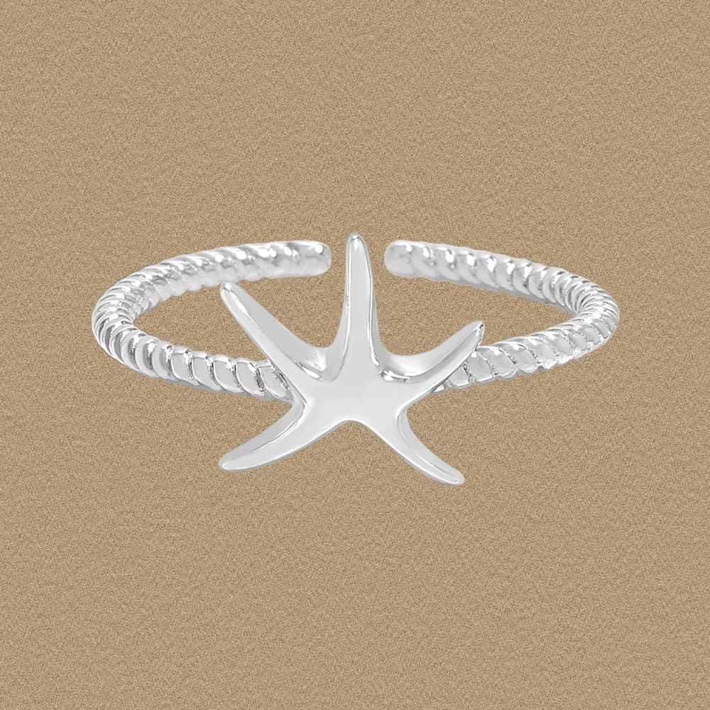 Polished sterling silver starfish ring with a twisted rope-textured band